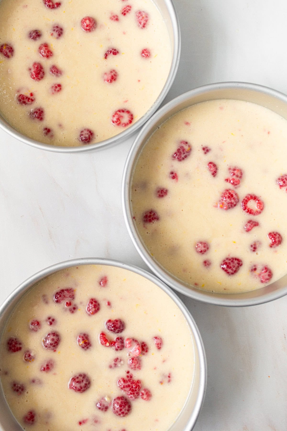 Lemon Raspberry Cake in three 8-inch cake pans