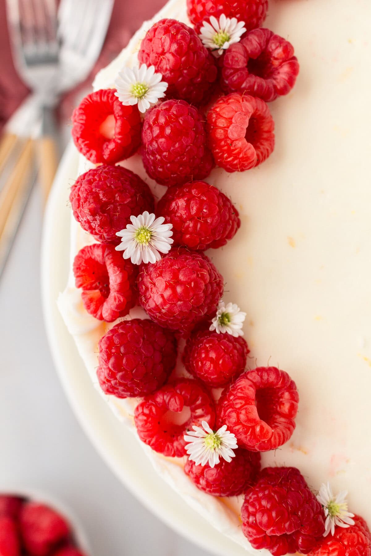 Lemon Raspberry Cake with Lemon Cream Cheese Frosting. A light and fluffy lemon cake with fresh raspberries and a fresh lemon cream cheese frosting. A sweet and tangy lemon berry cake!