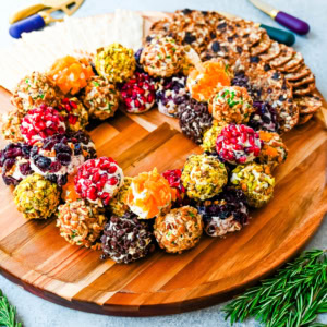 Mini Cheese Balls are the ultimate crowd-pleasing appetizer—bite-sized, creamy, and endlessly customizable. Whether you're hosting a party, creating a stunning charcuterie board, or need a quick snack for guests, these cheese ball bites will be a hit! With options ranging from savory herbs and spices to sweet fruity toppings, there are so many combinations to try. I am also sharing how to make a cheese ball Christmas tree and cheese ball Christmas wreath for a holiday appetizer idea.