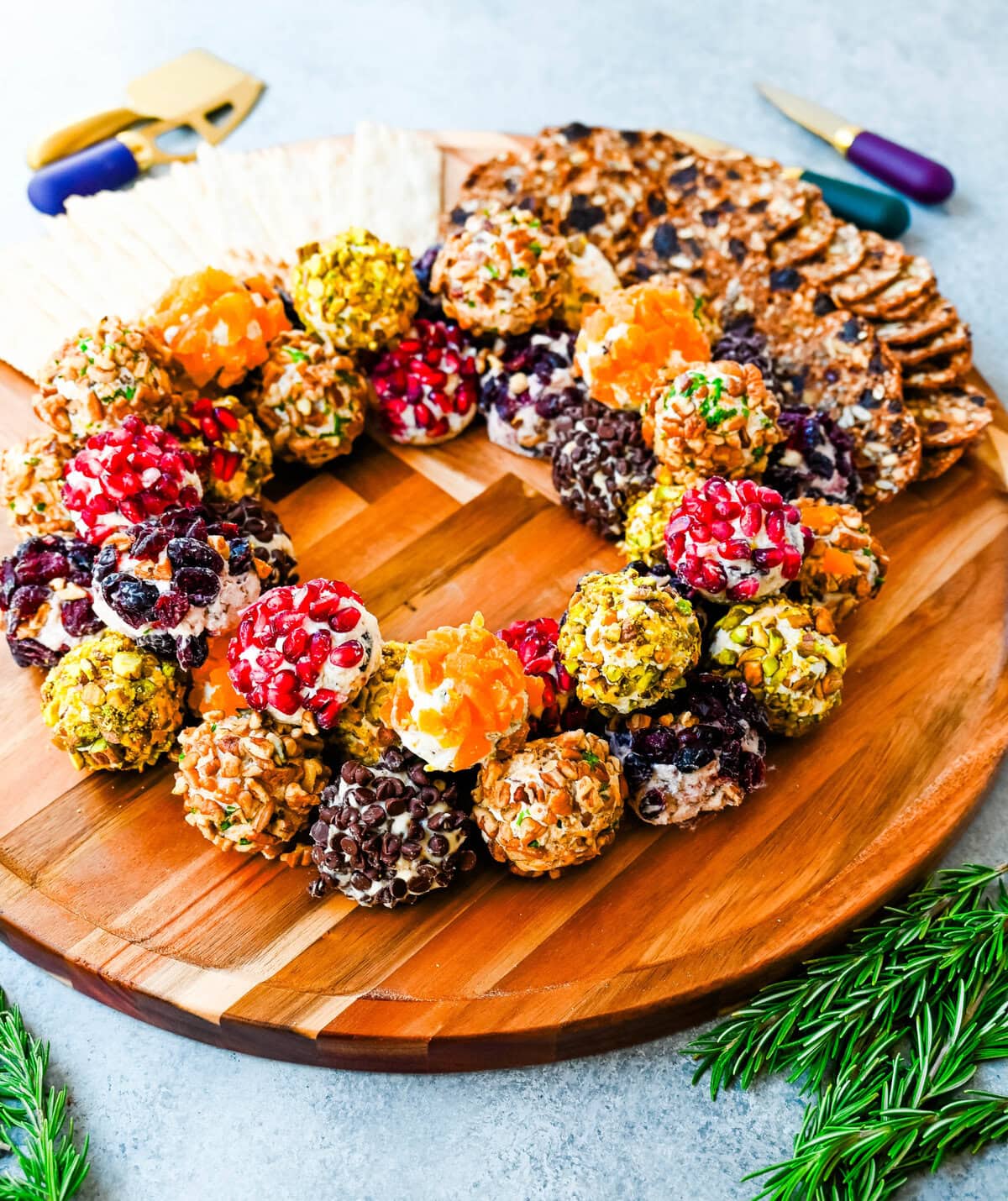 Mini Cheese Balls are the ultimate crowd-pleasing appetizer—bite-sized, creamy, and endlessly customizable. Whether you're hosting a party, creating a stunning charcuterie board, or need a quick snack for guests, these cheese ball bites will be a hit! With options ranging from savory herbs and spices to sweet fruity toppings, there are so many combinations to try. I am also sharing how to make a cheese ball Christmas tree and cheese ball Christmas wreath for a holiday appetizer idea.