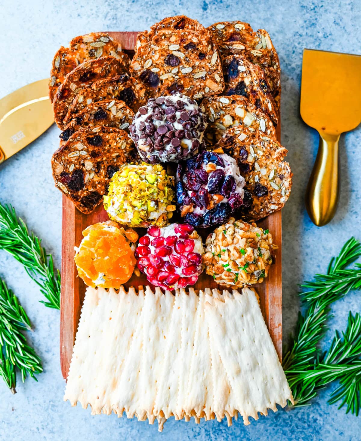 Mini Cheese Balls are the ultimate crowd-pleasing appetizer—bite-sized, creamy, and endlessly customizable. Whether you're hosting a party, creating a stunning charcuterie board, or need a quick snack for guests, these cheese ball bites will be a hit! With options ranging from savory herbs and spices to sweet fruity toppings, there are so many combinations to try. I am also sharing how to make a cheese ball Christmas tree and cheese ball Christmas wreath for a holiday appetizer idea.