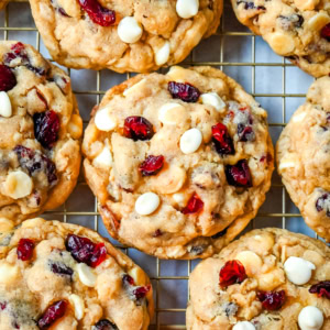 Soft, chewy, hearty oatmeal cranberry white chocolate chip cookies are made with tart dried cranberries, sweet white chocolate chips, and are always 5-star rated. The best Cranberry Oatmeal White Chocolate Chip Cookie recipe!