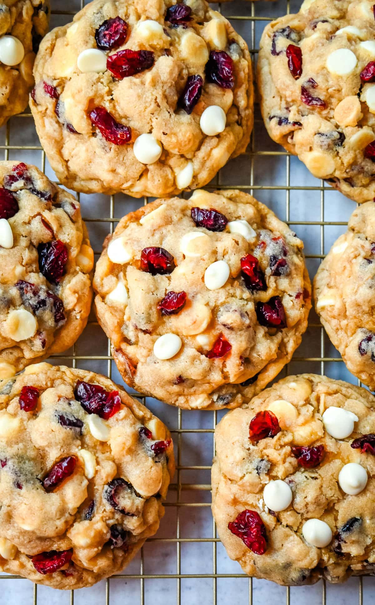 Soft, chewy, hearty oatmeal cranberry white chocolate chip cookies are made with tart dried cranberries, sweet white chocolate chips, and are always 5-star rated. The best Cranberry Oatmeal White Chocolate Chip Cookie recipe!