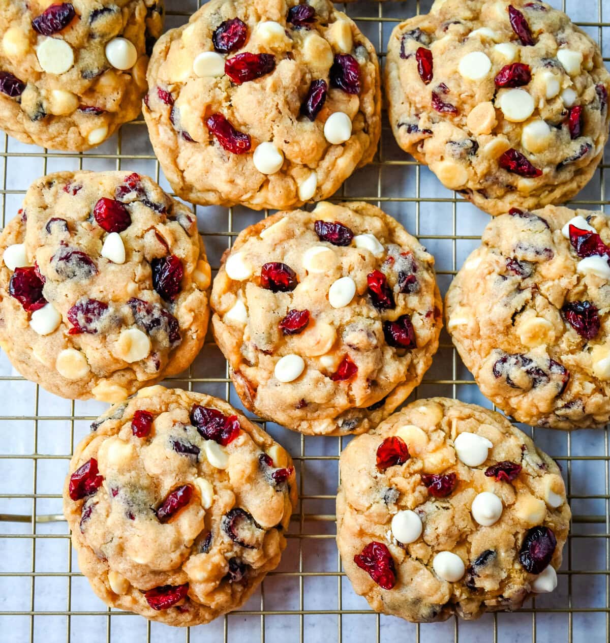 Soft, chewy, hearty oatmeal cranberry white chocolate chip cookies are made with tart dried cranberries, sweet white chocolate chips, and are always 5-star rated. The best Cranberry Oatmeal White Chocolate Chip Cookie recipe!