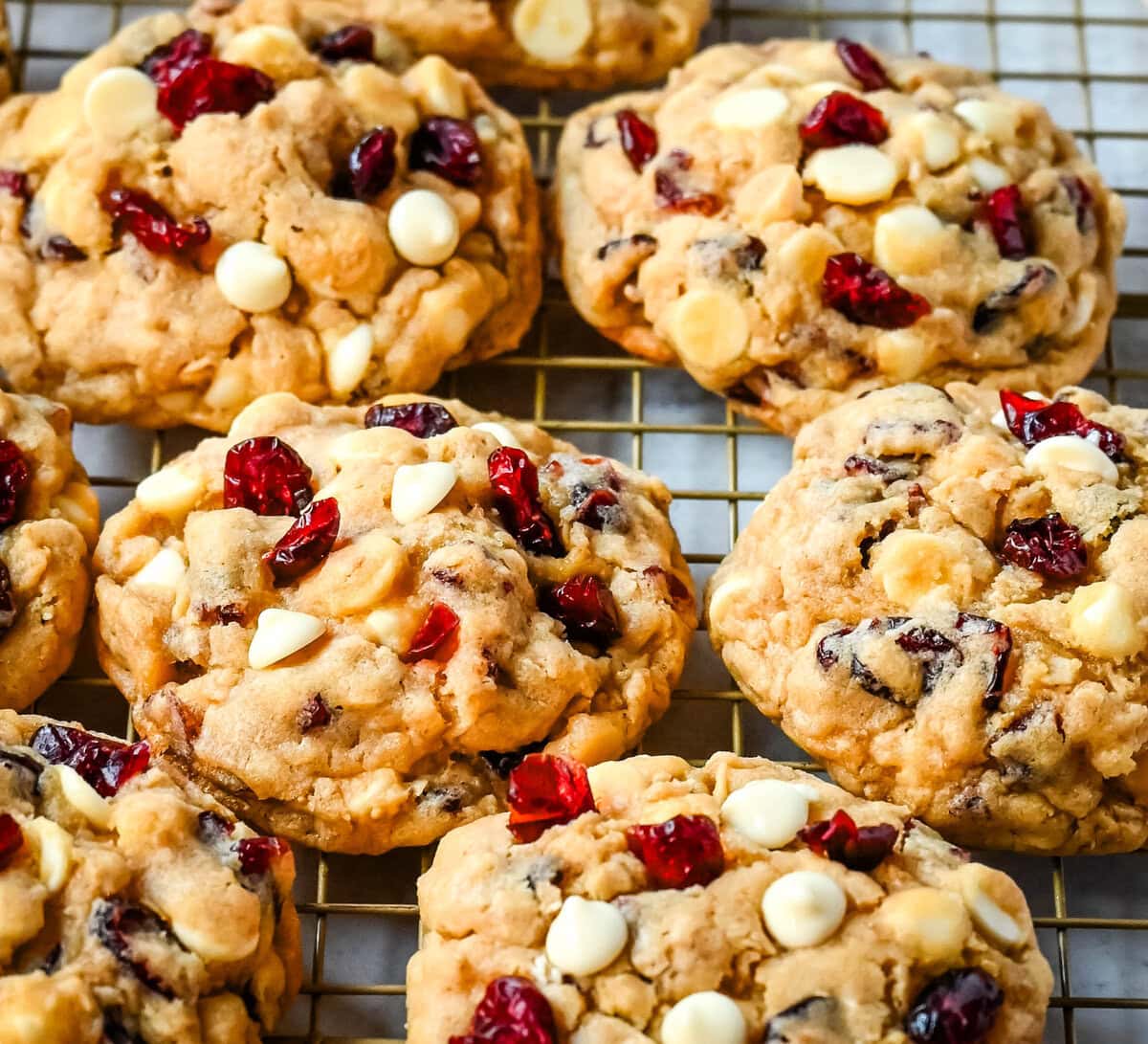 Soft, chewy, hearty oatmeal cranberry white chocolate chip cookies are made with tart dried cranberries, sweet white chocolate chips, and are always 5-star rated. The best Cranberry Oatmeal White Chocolate Chip Cookie recipe!