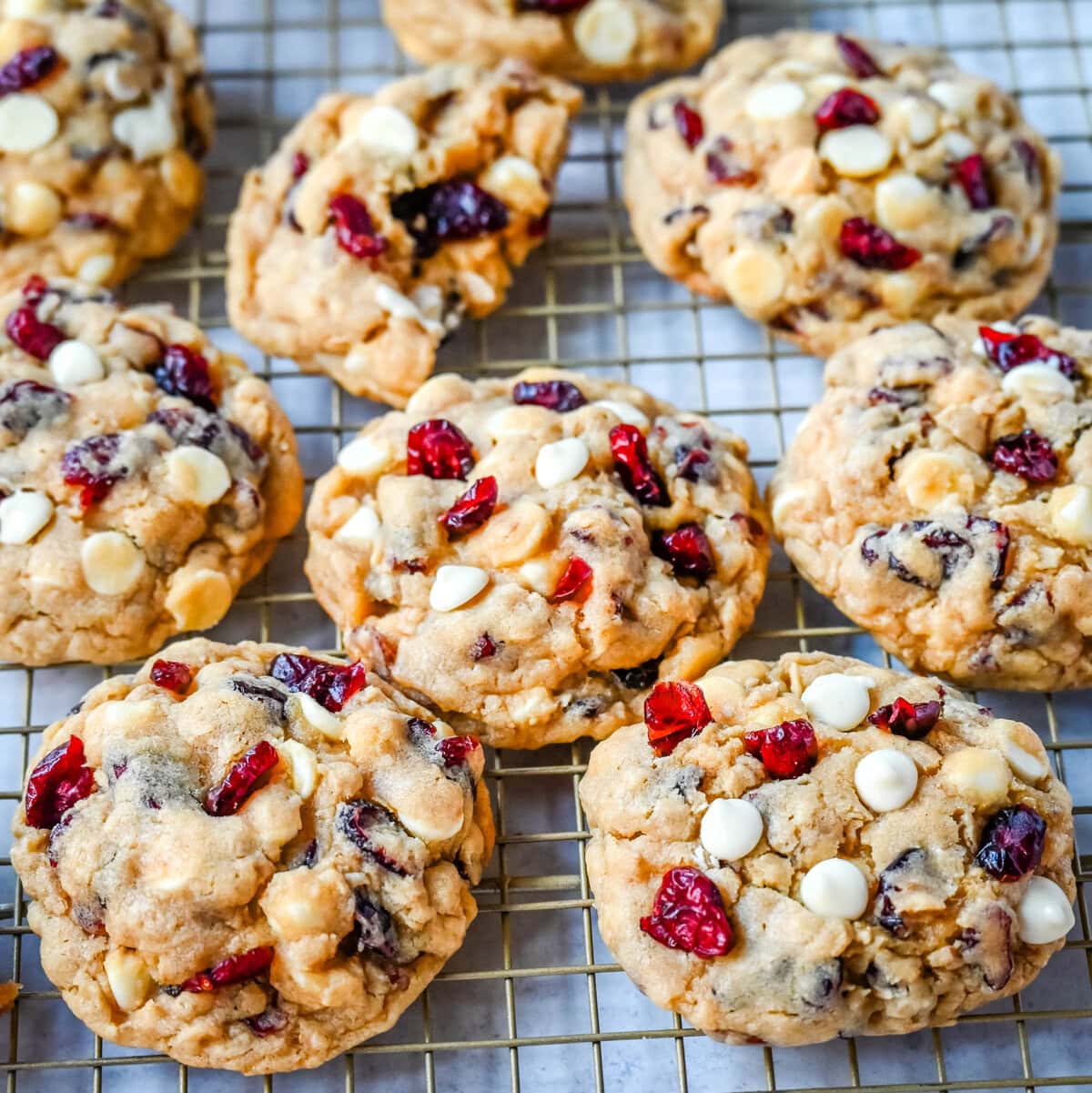 Soft, chewy, hearty oatmeal cranberry white chocolate chip cookies are made with tart dried cranberries, sweet white chocolate chips, and are always 5-star rated. The best Cranberry Oatmeal White Chocolate Chip Cookie recipe!