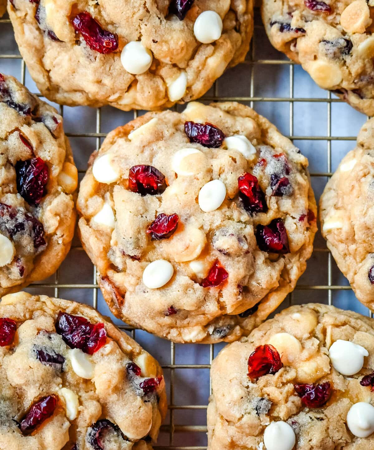 Soft, chewy, hearty oatmeal cranberry white chocolate chip cookies are made with tart dried cranberries, sweet white chocolate chips, and are always 5-star rated. The best Cranberry Oatmeal White Chocolate Chip Cookie recipe!