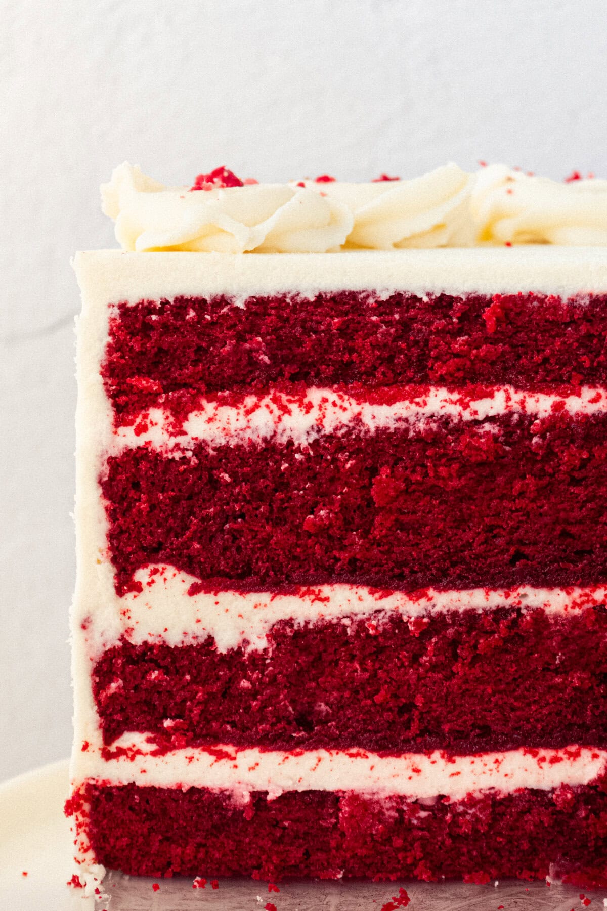 How to make the best red velvet cake with cream cheese frosting. Homemade Red Velvet Cake is soft, tender, and fluffy with the creamiest and most decadent cream cheese frosting. It is no wonder that it is one of the most popular cake recipes and this is the perfect recipe.