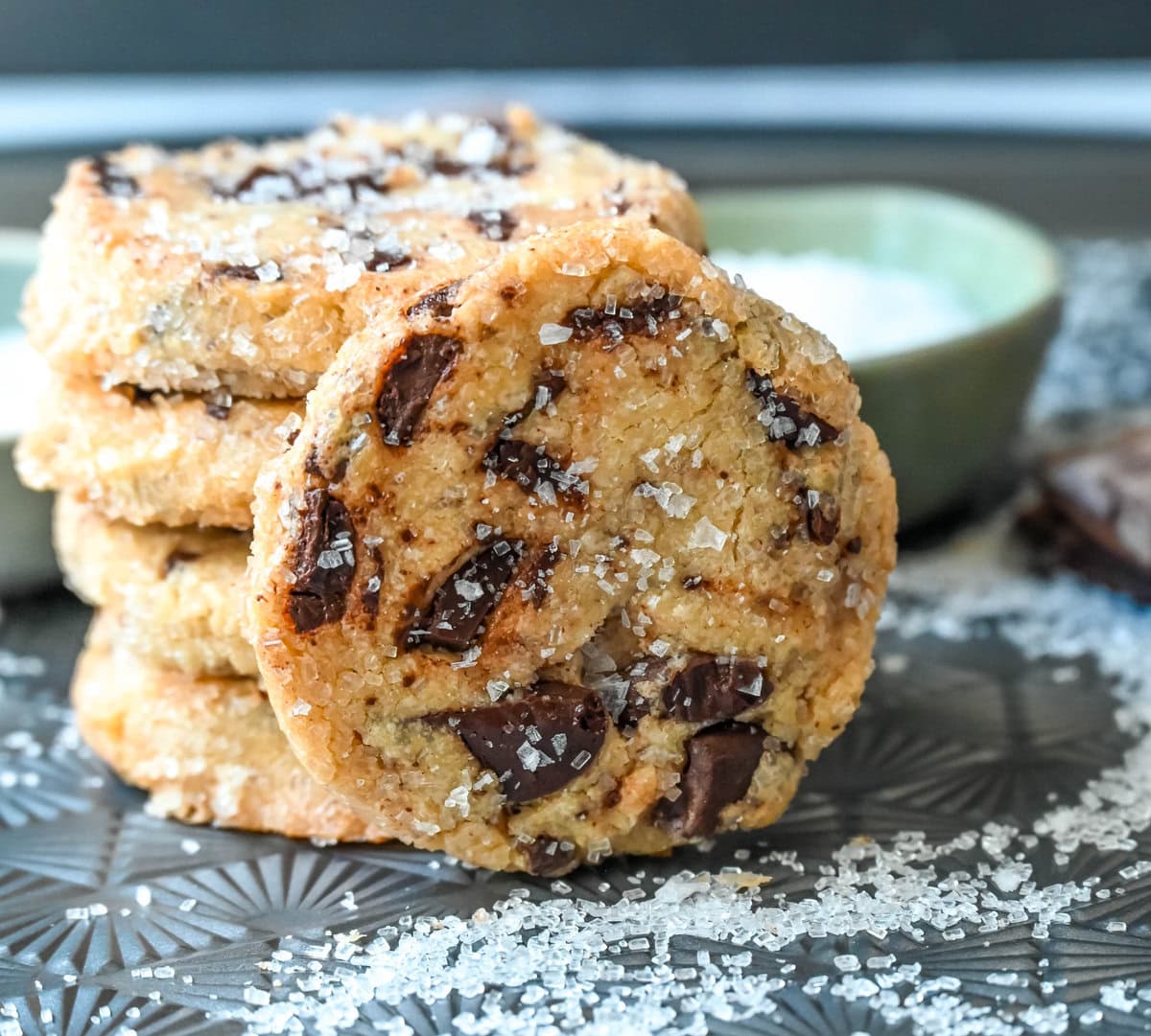 Salted chocolate chunk shortbread cookies are a twist on the classic chocolate chunk cookie, combining buttery, crumbly shortbread with rich chocolate chunks and a hint of flaky sea salt. These chocolate chip shortbread cookies are a perfect balance of sweet, salty, and savory flavors with a melt-in-your-mouth texture.