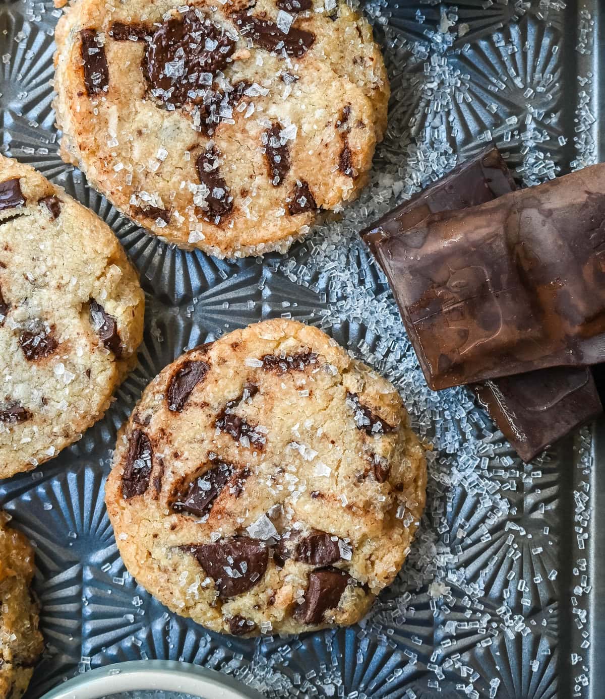 Salted chocolate chunk shortbread cookies are a twist on the classic chocolate chunk cookie, combining buttery, crumbly shortbread with rich chocolate chunks and a hint of flaky sea salt. These chocolate chip shortbread cookies are a perfect balance of sweet, salty, and savory flavors with a melt-in-your-mouth texture.