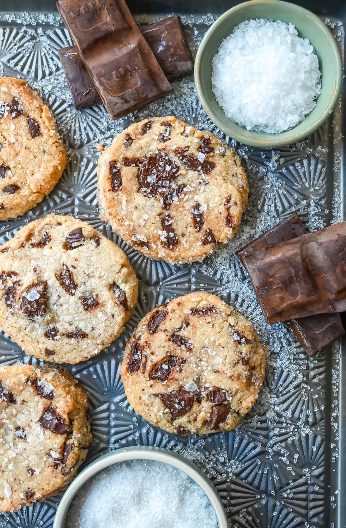 Salted chocolate chunk shortbread cookies are a twist on the classic chocolate chunk cookie, combining buttery, crumbly shortbread with rich chocolate chunks and a hint of flaky sea salt. These chocolate chip shortbread cookies are a perfect balance of sweet, salty, and savory flavors with a melt-in-your-mouth texture.