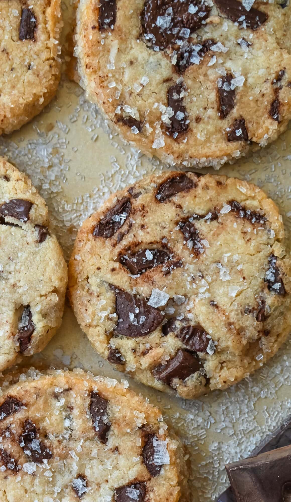 Salted chocolate chunk shortbread cookies are a twist on the classic chocolate chunk cookie, combining buttery, crumbly shortbread with rich chocolate chunks and a hint of flaky sea salt. These chocolate chip shortbread cookies are a perfect balance of sweet, salty, and savory flavors with a melt-in-your-mouth texture.