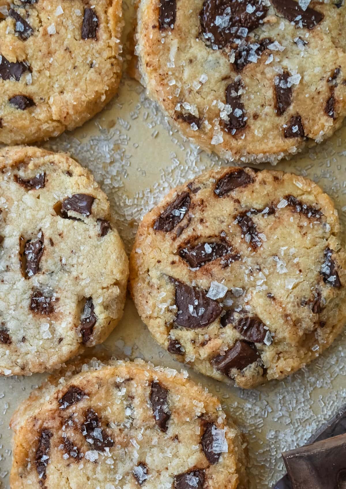 Salted chocolate chunk shortbread cookies are a twist on the classic chocolate chunk cookie, combining buttery, crumbly shortbread with rich chocolate chunks and a hint of flaky sea salt. These chocolate chip shortbread cookies are a perfect balance of sweet, salty, and savory flavors with a melt-in-your-mouth texture.