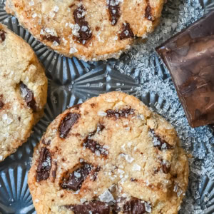 Salted chocolate chunk shortbread cookies are a twist on the classic chocolate chunk cookie, combining buttery, crumbly shortbread with rich chocolate chunks and a hint of flaky sea salt. These chocolate chip shortbread cookies are a perfect balance of sweet, salty, and savory flavors with a melt-in-your-mouth texture.