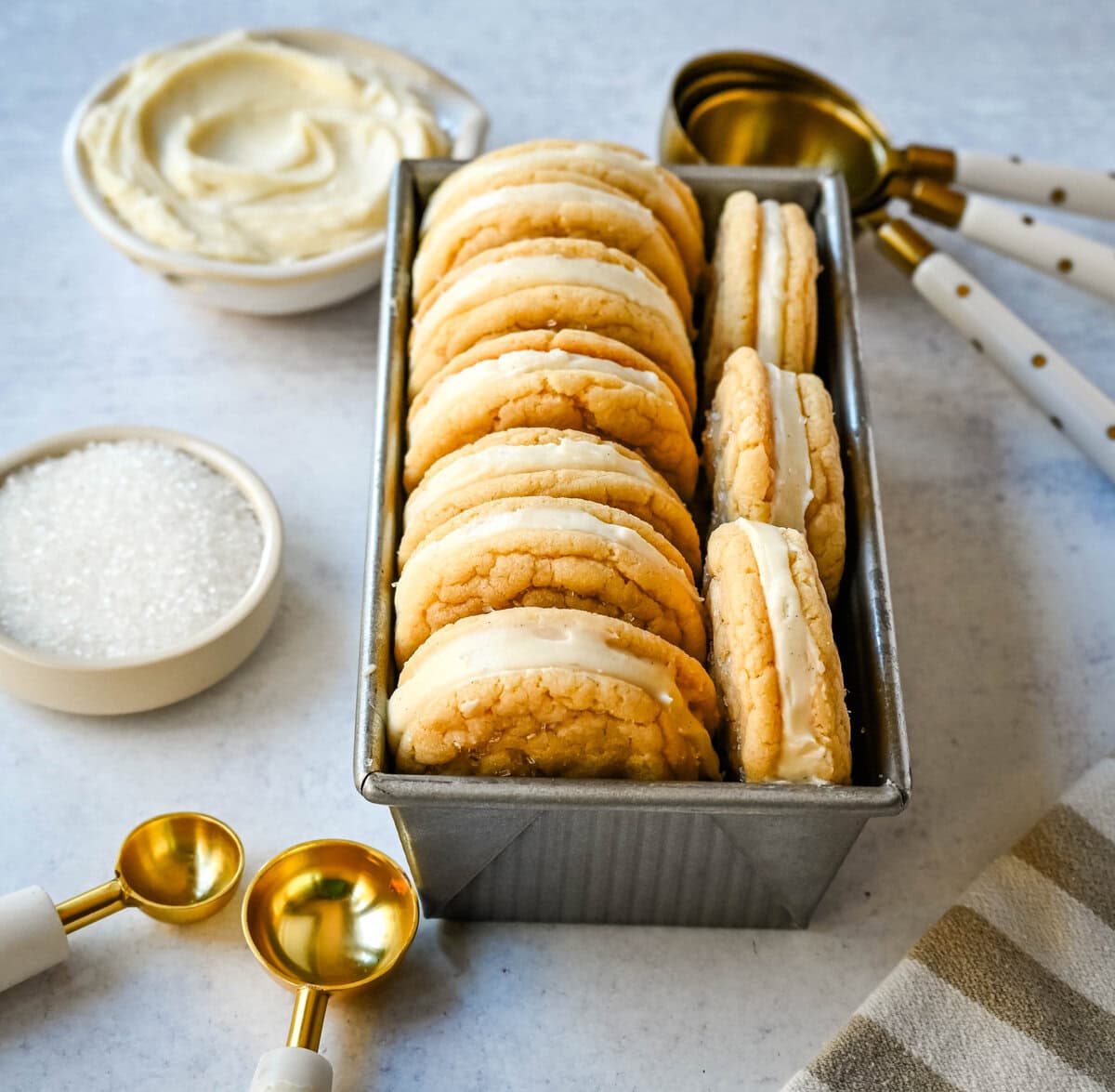 Sugar Sandwich Cookies with Cream Cheese Frosting are two soft and tender, buttery sugar cookies sandwiched with creamy and sweet cream cheese filling. These Homemade Sugar Cookie Oreos are soft, chewy and filled with the best cream cheese frosting.