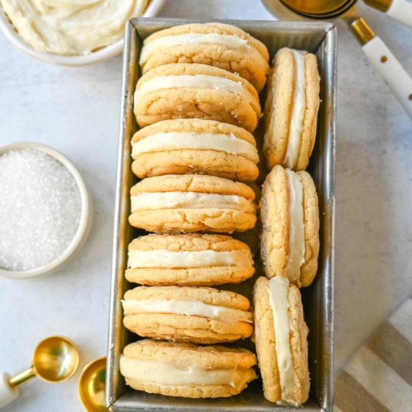 Sugar Sandwich Cookies with Cream Cheese Frosting are two soft and tender, buttery sugar cookies sandwiched with creamy and sweet cream cheese filling. These Homemade Sugar Cookie Oreos are soft, chewy and filled with the best cream cheese frosting.