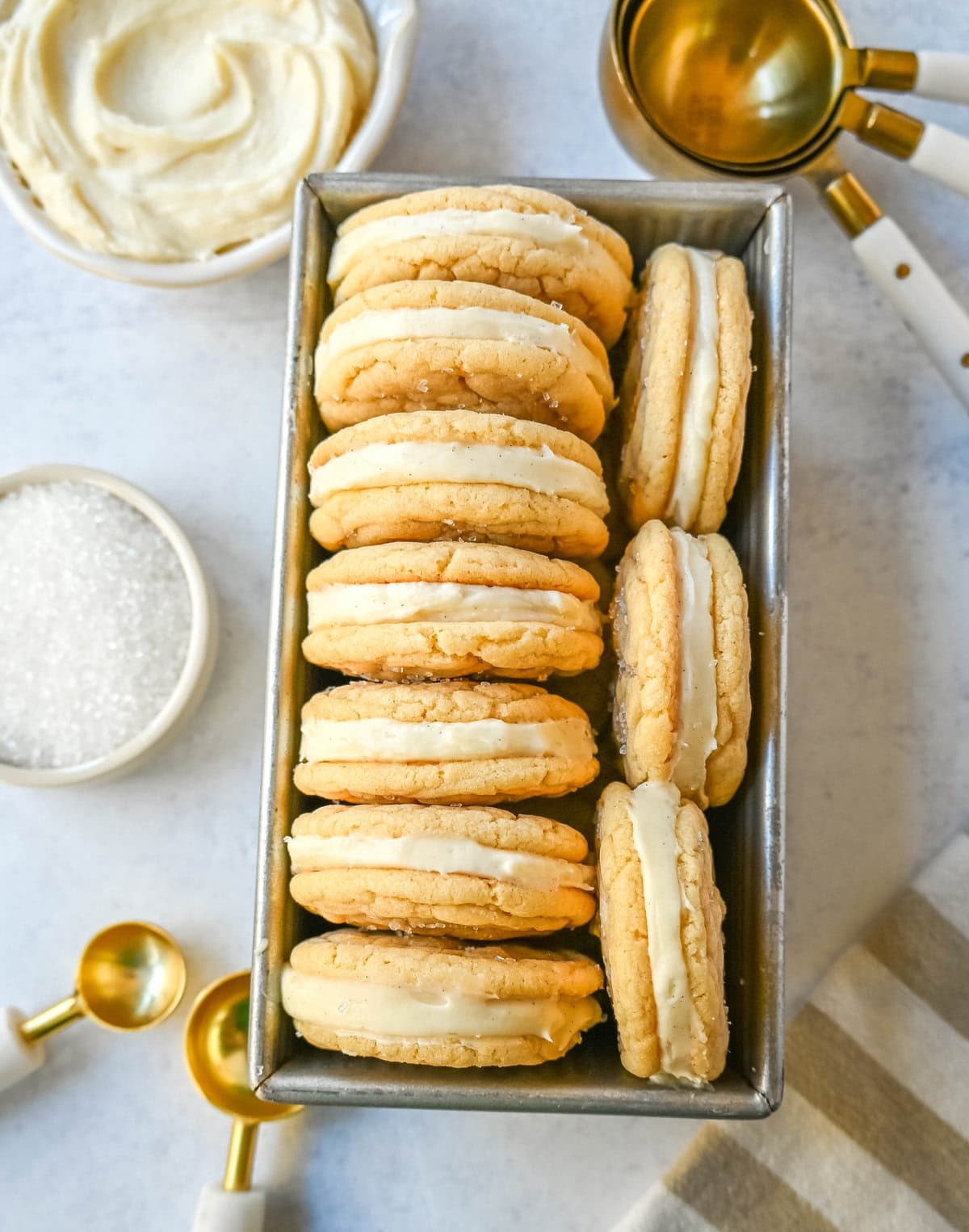 Sugar Sandwich Cookies with Cream Cheese Frosting are two soft and tender, buttery sugar cookies sandwiched with creamy and sweet cream cheese filling. These Homemade Sugar Cookie Oreos are soft, chewy and filled with the best cream cheese frosting.