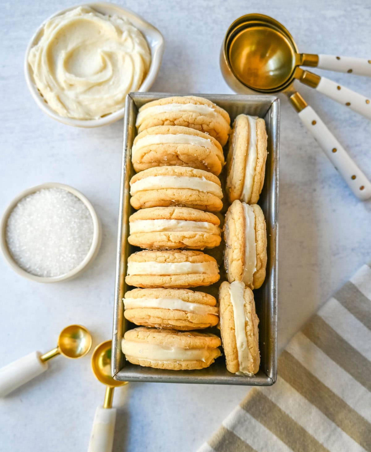 Sugar Sandwich Cookies with Cream Cheese Frosting are two soft and tender, buttery sugar cookies sandwiched with creamy and sweet cream cheese filling. These Homemade Sugar Cookie Oreos are soft, chewy and filled with the best cream cheese frosting.