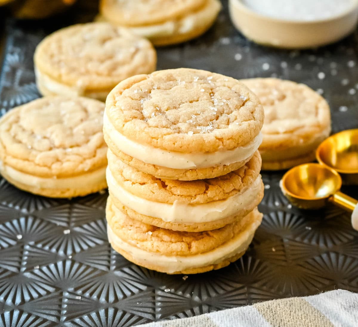 Sugar Sandwich Cookies with Cream Cheese Frosting are two soft and tender, buttery sugar cookies sandwiched with creamy and sweet cream cheese filling. These Homemade Sugar Cookie Oreos are soft, chewy and filled with the best cream cheese frosting.