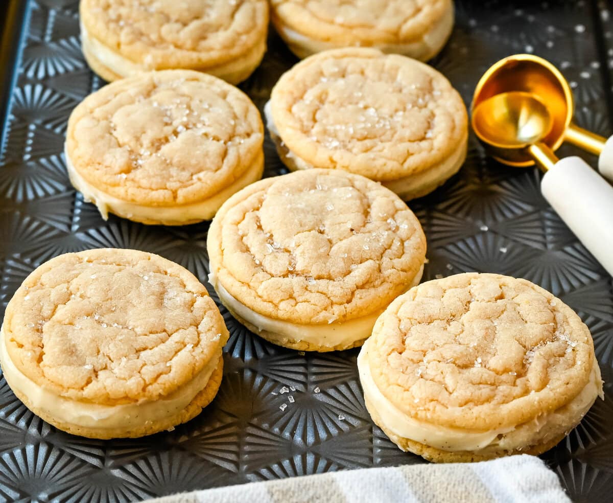 Sugar Sandwich Cookies with Cream Cheese Frosting are two soft and tender, buttery sugar cookies sandwiched with creamy and sweet cream cheese filling. These Homemade Sugar Cookie Oreos are soft, chewy and filled with the best cream cheese frosting.