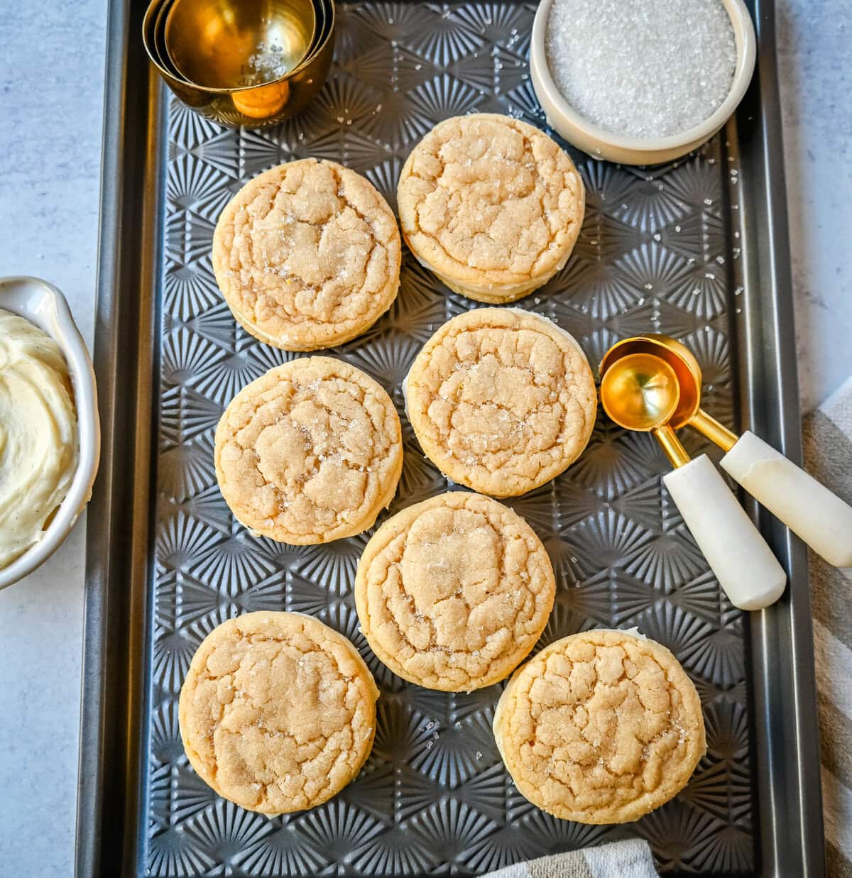 Sugar Sandwich Cookies with Cream Cheese Frosting are two soft and tender, buttery sugar cookies sandwiched with creamy and sweet cream cheese filling. These Homemade Sugar Cookie Oreos are soft, chewy and filled with the best cream cheese frosting.