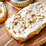 This homemade Swedish Pastry, also known as Danish Kringle, features a buttery crust, an almond filling, and topped with an almond frosting. This buttery pastry is buttery, creamy, and has just the right sweetness. A holiday tradition!