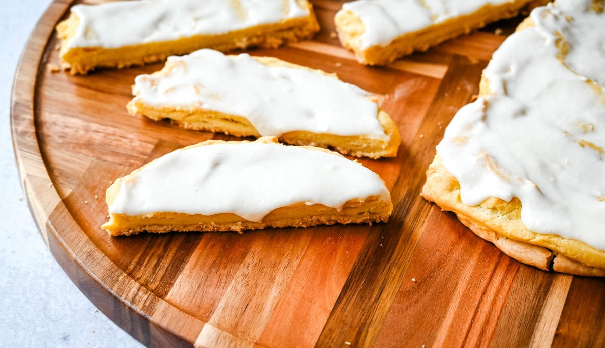 This homemade Swedish Pastry, also known as Danish Kringle, features a buttery crust, an almond filling, and topped with an almond frosting. This buttery pastry is buttery, creamy, and has just the right sweetness. A holiday tradition!