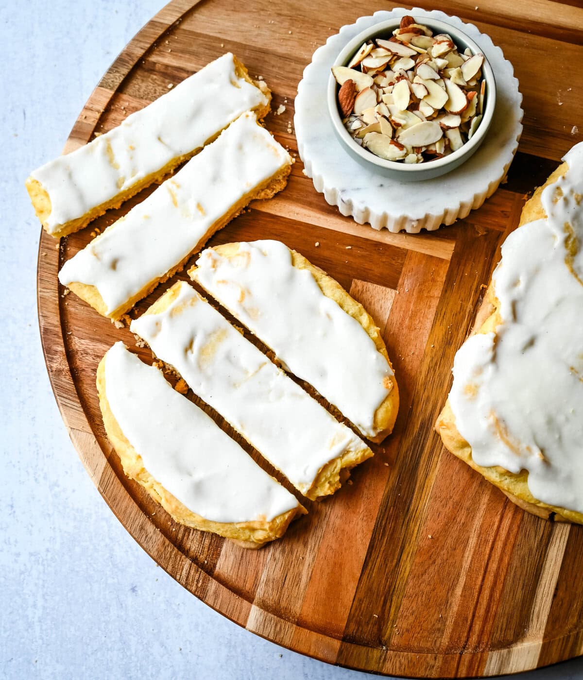 This homemade Swedish Pastry, also known as Danish Kringle, features a buttery crust, an almond filling, and topped with an almond frosting. This buttery pastry is buttery, creamy, and has just the right sweetness. A holiday tradition!