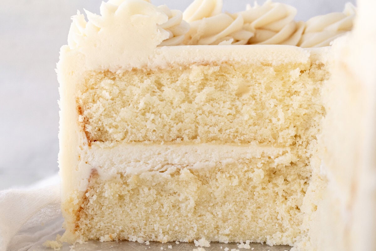 The best homemade vanilla cake recipe with vanilla bean buttercream frosting. If you’re looking for the best homemade vanilla cake recipe, this is it! This moist and fluffy vanilla cake is easy to make from scratch using simple ingredients. Perfect for birthdays or celebrations. This white cake recipe features a light, airy crumb and the most tender texture. This is a bakery-worthy dessert!