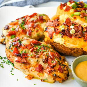 Cheesy Bacon Smothered Chicken. This juicy, marinated grilled chicken breast is smothered with honey mustard sauce, melted cheese, and crispy bacon. To make it extra flavorful, add caramelized onions or mushrooms. You may know this as the famous Alice Springs Chicken from Outback Steakhouse but you can make it at home.