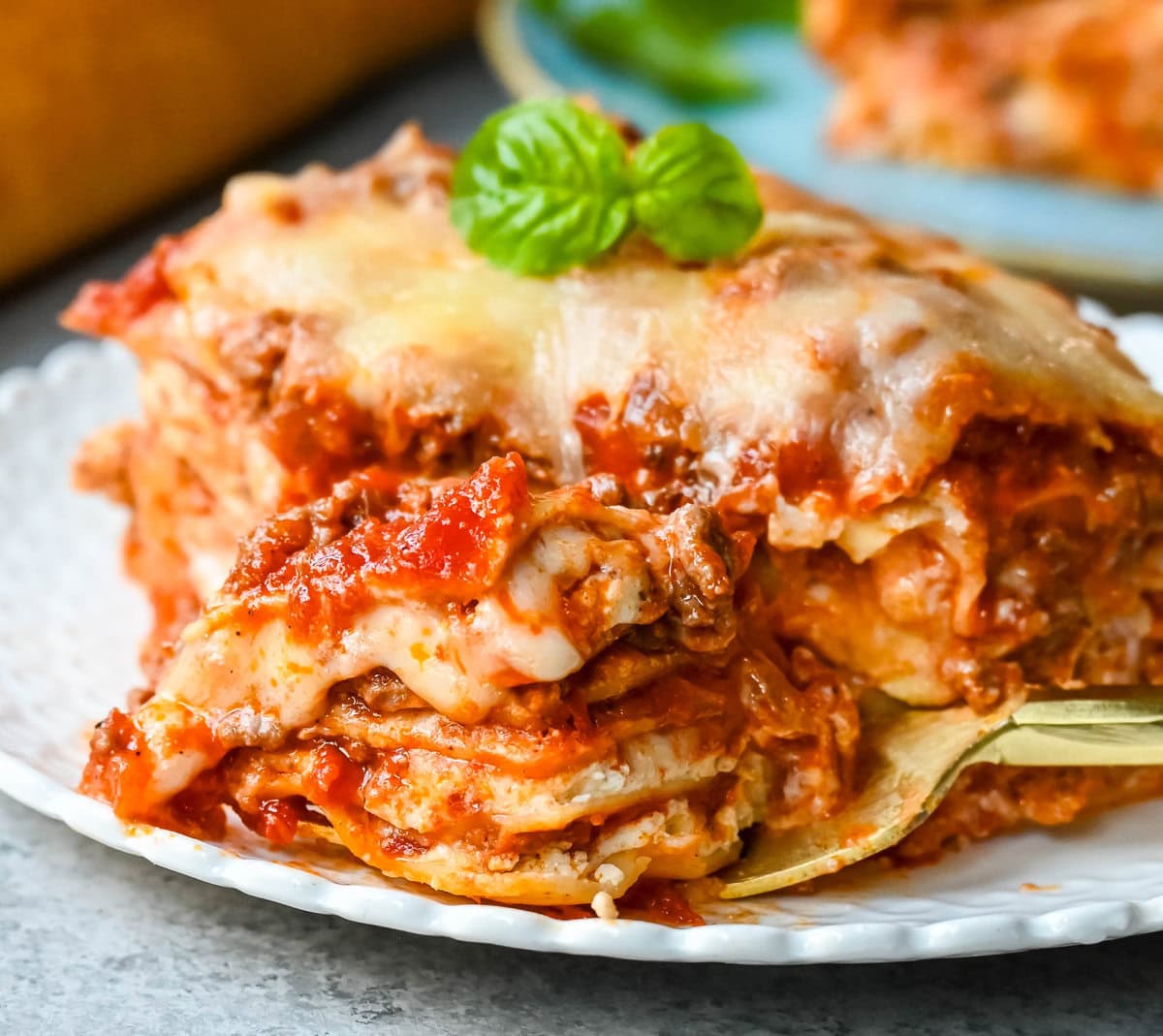 Classic Lasagna Recipe. The perfect lasagna recipe made with parmesan ricotta cheese filling, melted mozzarella cheese, lasagna noodles, and a robust tomato meat sauce. It is the best lasagna recipe!