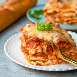 Classic Lasagna Recipe. The perfect lasagna recipe made with parmesan ricotta cheese filling, melted mozzarella cheese, lasagna noodles, and a robust tomato meat sauce. It is the best lasagna recipe!