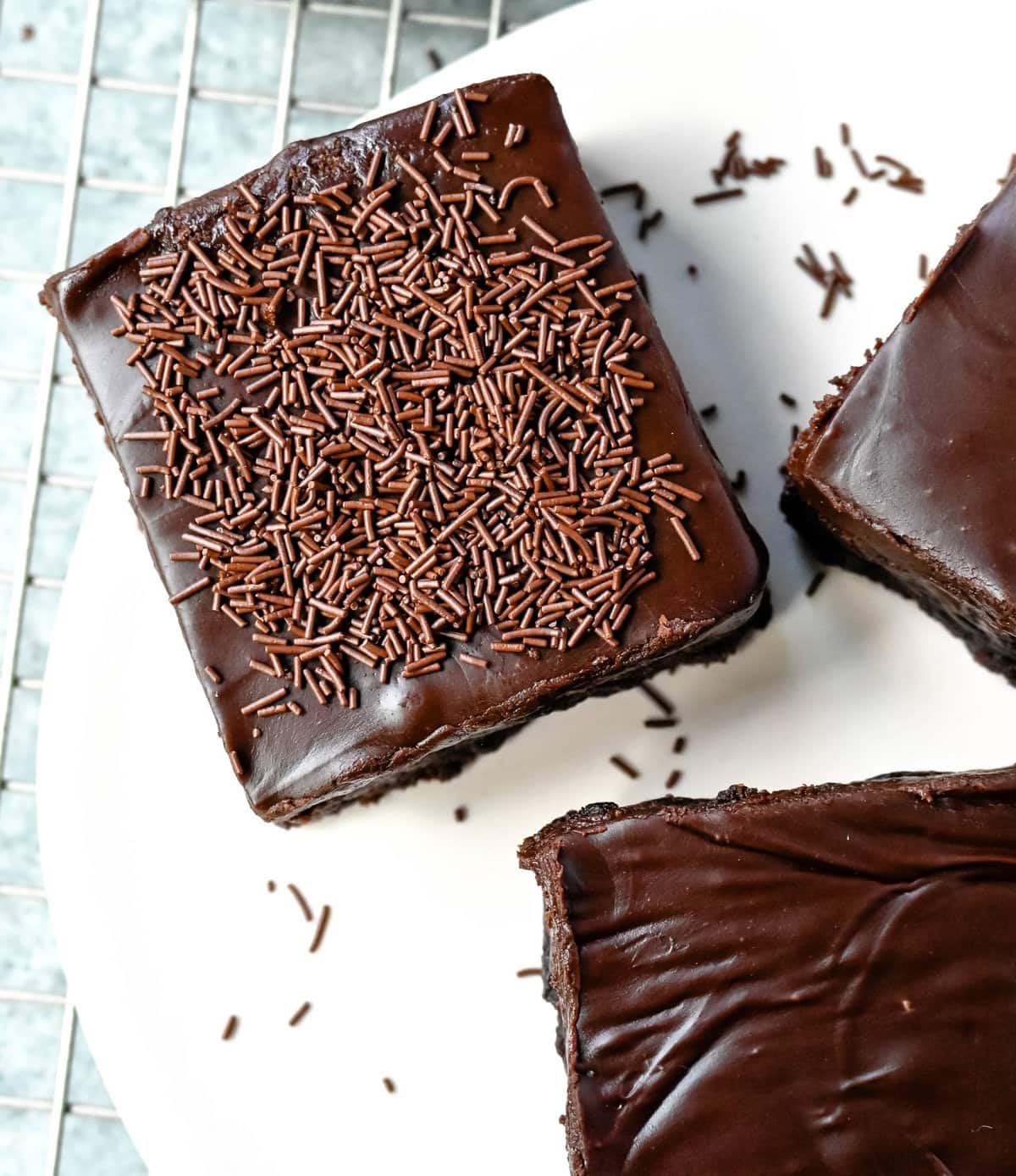 These Lunch Lady Frosted Brownies are rich, fudgy brownies topped with a silky, velvety chocolate frosting. These Frosted Brownies are the best chocolate dessert bar recipe. If you love chocolate, you will love these Brownies with Chocolate Frosting.