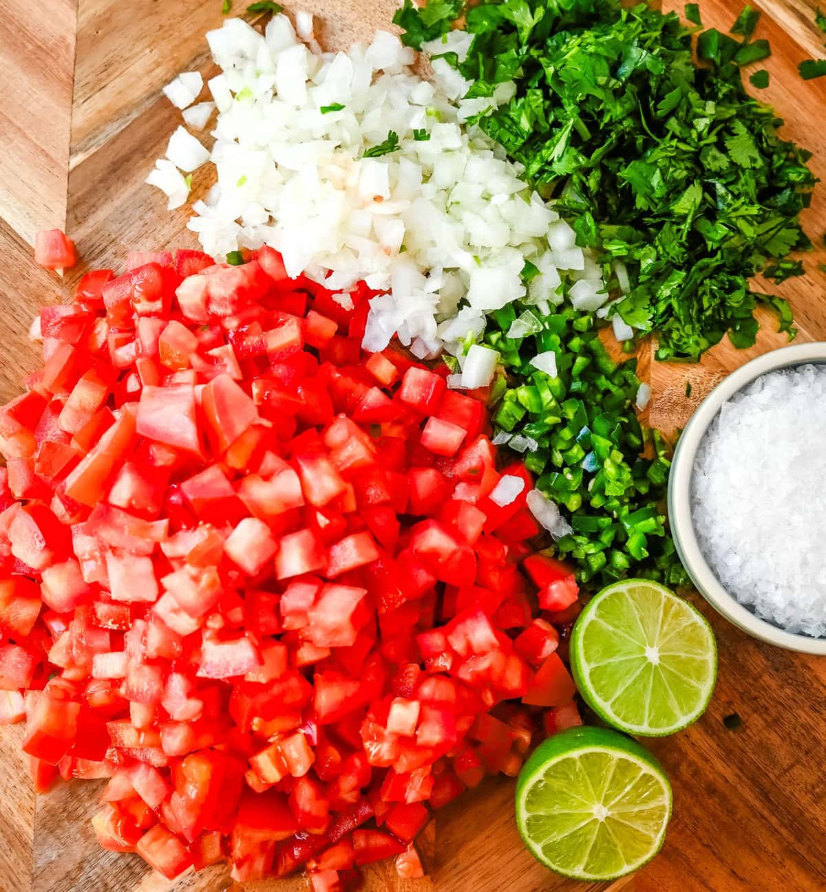 How to make homemade pico de gallo with only 6 ingredients -- tomatoes, onion, cilantro, jalapeno, lime juice, and salt.