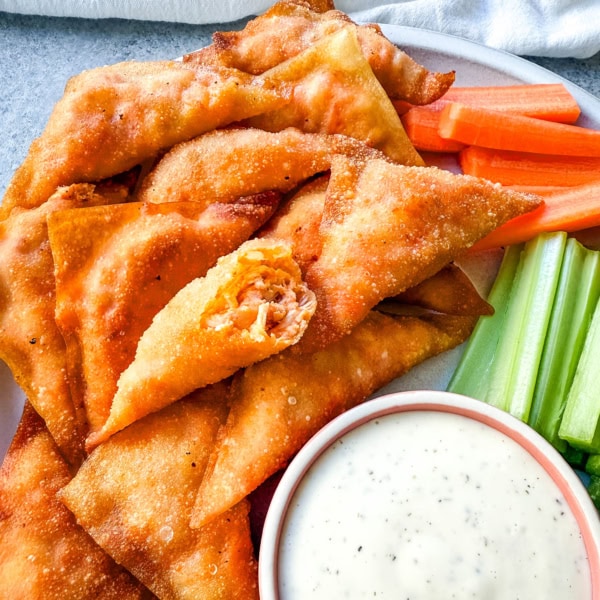 Buffalo Blasts are a crispy, spicy, and flavorful appetizer that combines tangy buffalo chicken and cheese in golden fried pockets. These bite-size appetizers made with a blend of melted cheese, tender chicken, and zesty buffalo sauce, are wrapped in wonton wrappers and fried to golden perfection. These popular Cheesecake Factory Buffalo Blasts are a super popular appetizer.