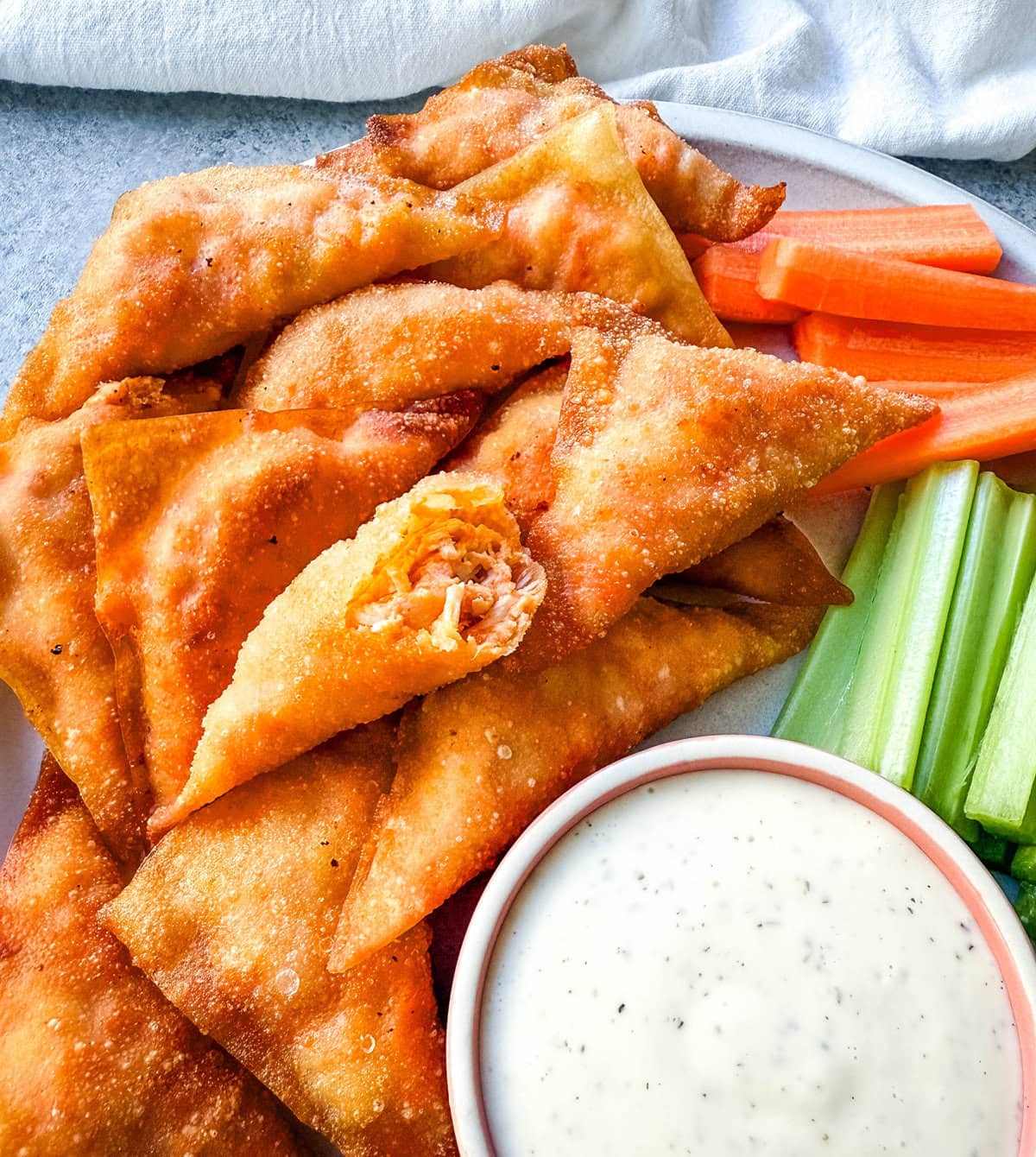 Buffalo Blasts are a crispy, spicy, and flavorful appetizer that combines tangy buffalo chicken and cheese in golden fried pockets. These bite-size appetizers made with a blend of melted cheese, tender chicken, and zesty buffalo sauce, are wrapped in wonton wrappers and fried to golden perfection. These popular Cheesecake Factory Buffalo Blasts are a super popular appetizer.