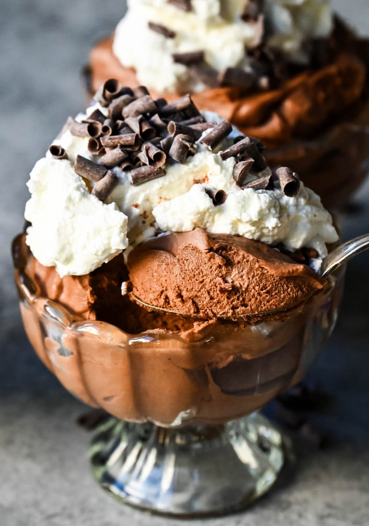 This chocolate mousse recipe is a rich and decadent chocolate dessert but is super simple to make. This is a quick and easy chocolate mousse recipe without eggs and relying on whipped heavy cream for a light and airy texture. This is the best chocolate mousse recipe!