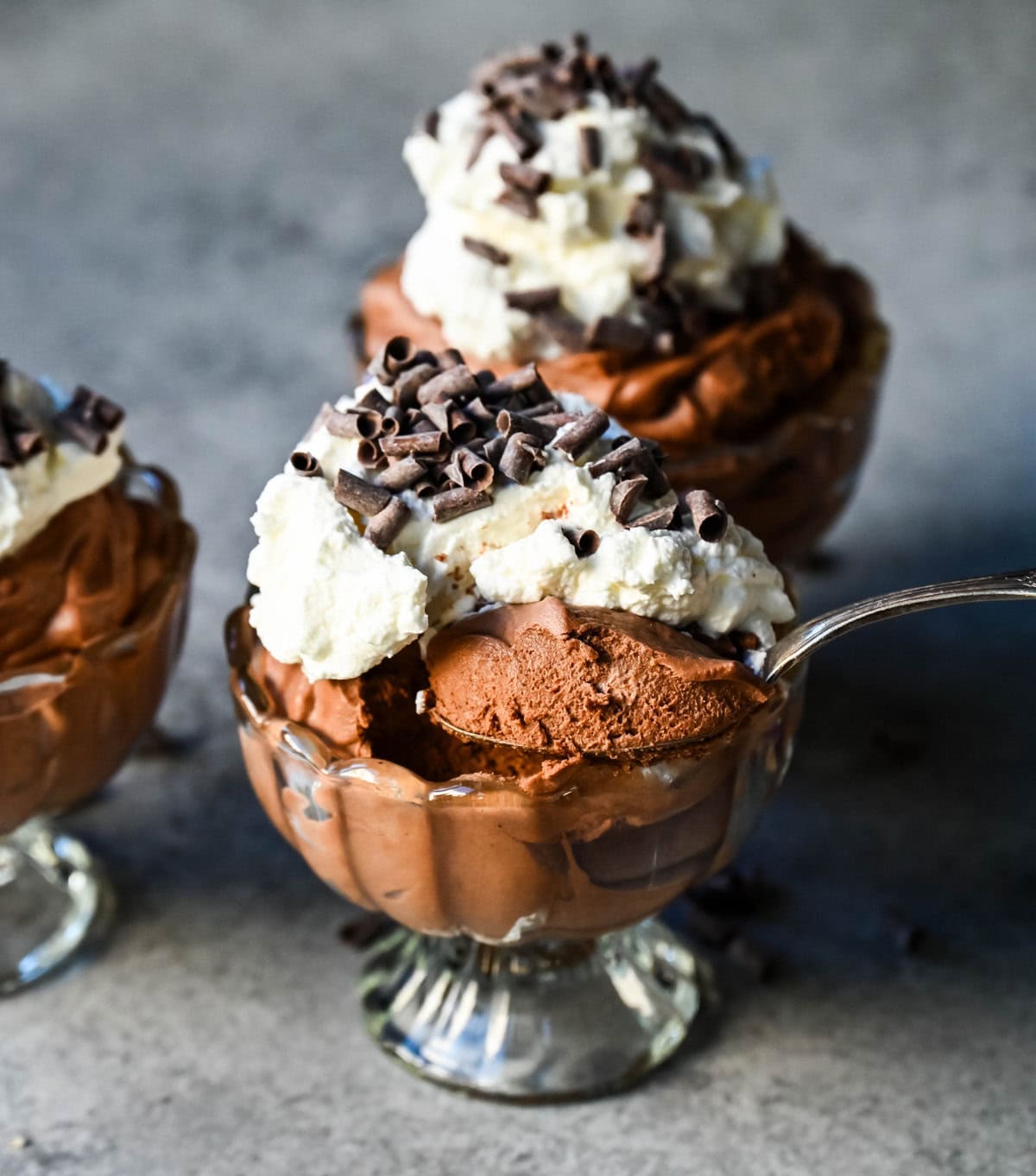 This chocolate mousse recipe is a rich and decadent chocolate dessert but is super simple to make. This is a quick and easy chocolate mousse recipe without eggs and relying on whipped heavy cream for a light and airy texture. This is the best chocolate mousse recipe!