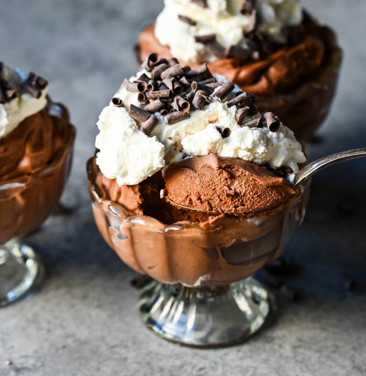 This chocolate mousse recipe is a rich and decadent chocolate dessert but is super simple to make. This is a quick and easy chocolate mousse recipe without eggs and relying on whipped heavy cream for a light and airy texture. This is the best chocolate mousse recipe!