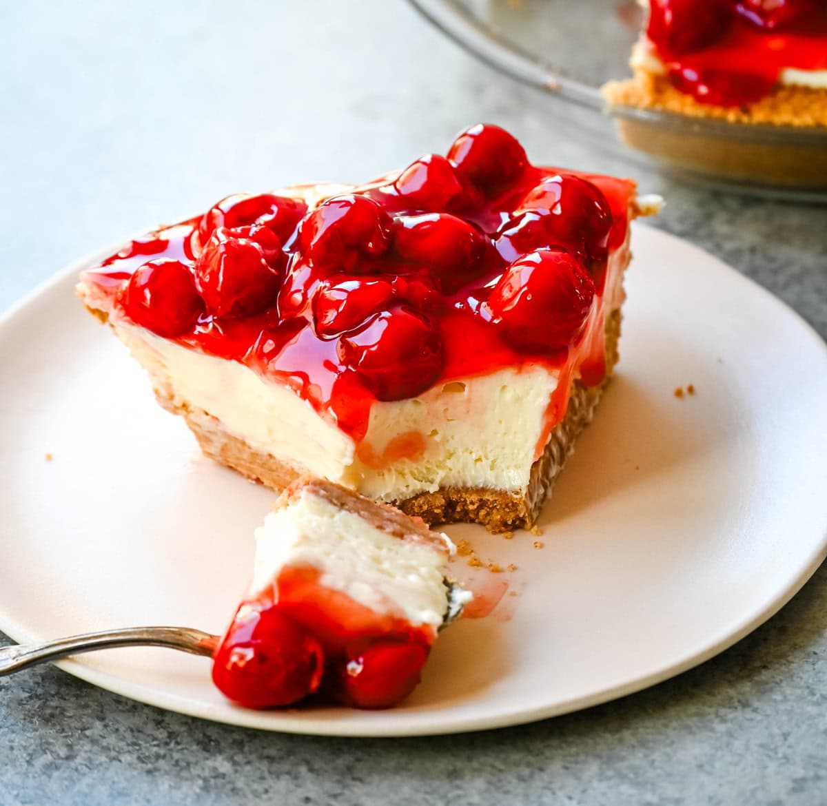 This easy No-Bake Cheesecake Recipe is made with a luscious filling made with sweetened condensed milk, cream cheese, and lemon juice, all piled onto a homemade graham cracker crust. This No Bake Cheesecake with sweetened condensed milk is perfect for when you want an effortless dessert that is easy to whip up and always a crowd pleaser.  