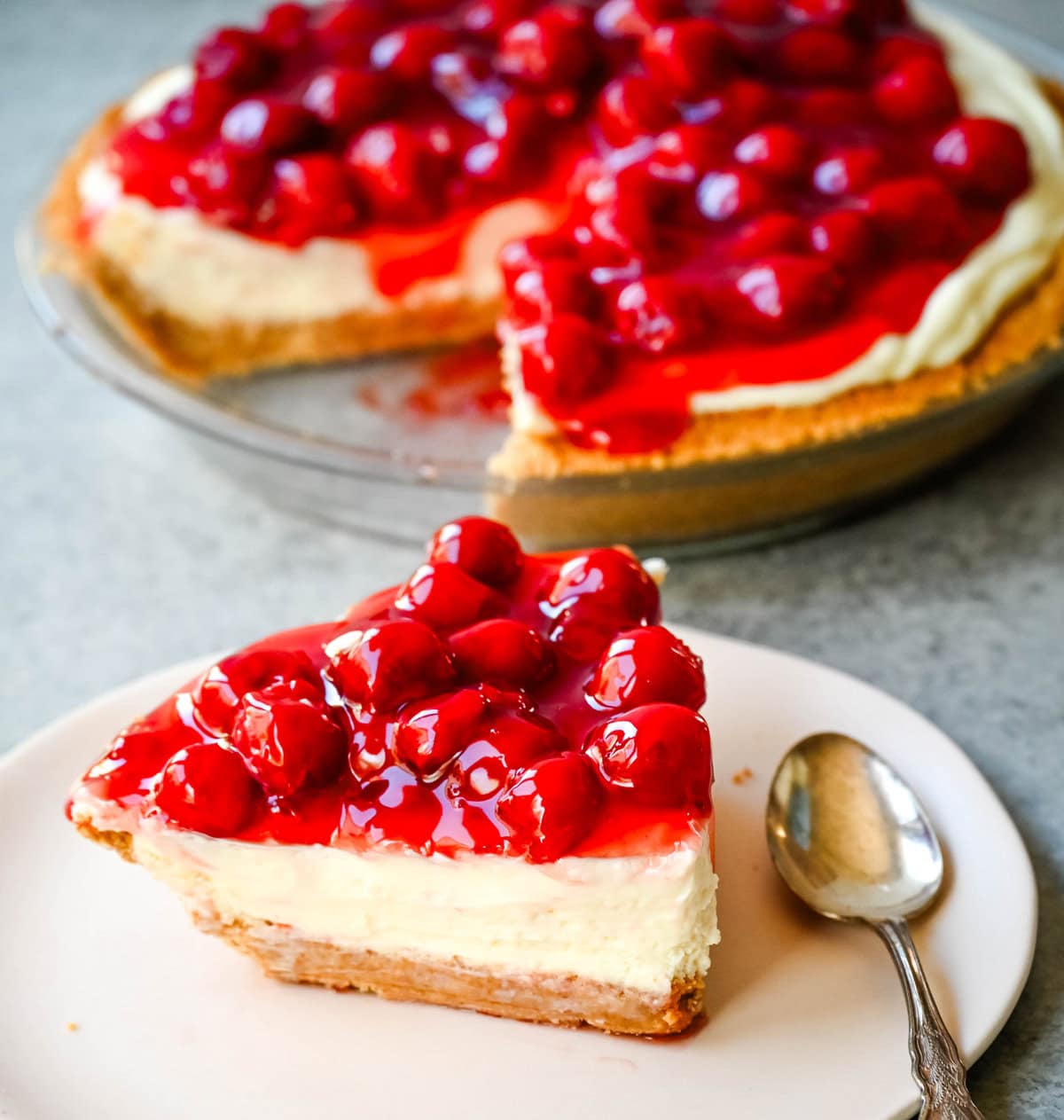 This easy No-Bake Cheesecake Recipe is made with a luscious filling made with sweetened condensed milk, cream cheese, and lemon juice, all piled onto a homemade graham cracker crust. This No Bake Cheesecake with sweetened condensed milk is perfect for when you want an effortless dessert that is easy to whip up and always a crowd pleaser.  