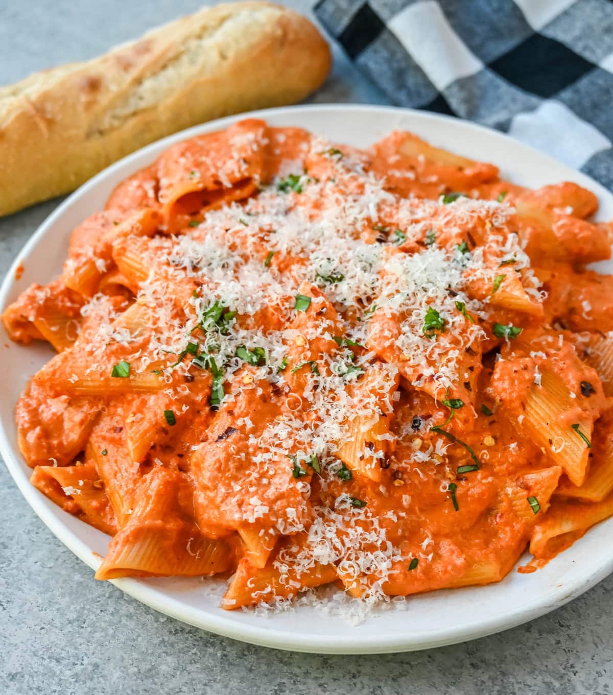 Penne alla Vodka is a classic Italian-American dish featuring a rich, creamy tomato sauce with a touch of vodka. While the alcohol cooks off, the vodka adds a subtle depth and brightness that sets this recipe apart from a standard marinara or tomato cream sauce. You will love this Love at First Bite Pasta!