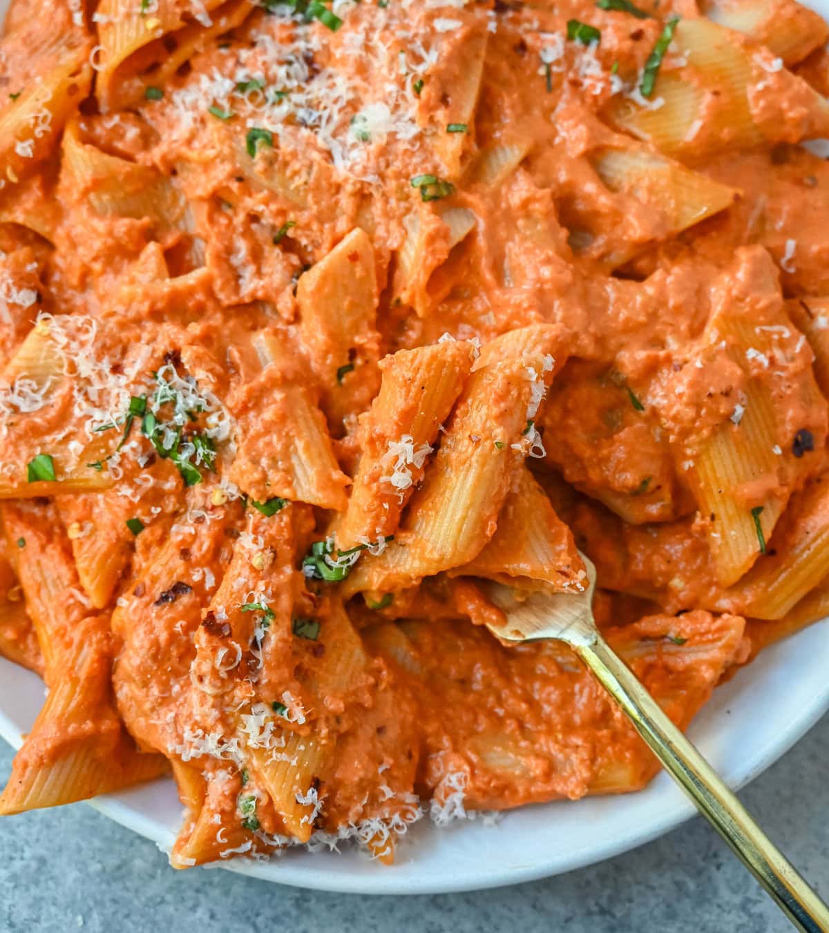 Penne alla Vodka is a classic Italian-American dish featuring a rich, creamy tomato sauce with a touch of vodka. While the alcohol cooks off, the vodka adds a subtle depth and brightness that sets this recipe apart from a standard marinara or tomato cream sauce. You will love this Love at First Bite Pasta!