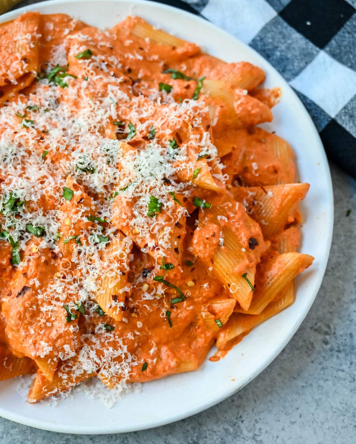 Penne alla Vodka is a classic Italian-American dish featuring a rich, creamy tomato sauce with a touch of vodka. While the alcohol cooks off, the vodka adds a subtle depth and brightness that sets this recipe apart from a standard marinara or tomato cream sauce. You will love this Love at First Bite Pasta!