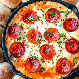 Hot Pepperoni Pizza Dip is a delicious and cheesy appetizer that brings all the classic pizza flavors. Loaded with melted cheeses, tangy marinara sauce, creamy cream cheese, and plenty of crispy pepperoni, this party dip is perfect for game days, potlucks, or get-togethers. It’s an easy appetizer recipe that can be whipped up in no time with minimal effort. The hot pepperoni pizza dip pairs well with homemade pizza dough rolls.