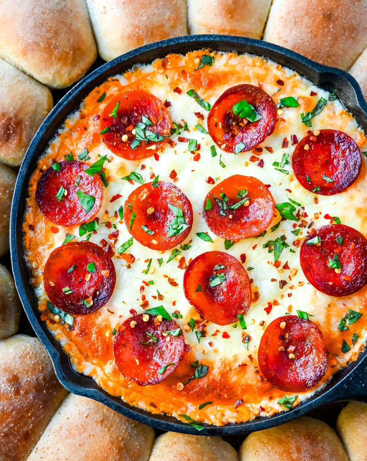 Hot Pepperoni Pizza Dip is a delicious and cheesy appetizer that brings all the classic pizza flavors. Loaded with melted cheeses, tangy marinara sauce, creamy cream cheese, and plenty of crispy pepperoni, this party dip is perfect for game days, potlucks, or get-togethers. It’s an easy appetizer recipe that can be whipped up in no time with minimal effort. The hot pepperoni pizza dip pairs well with homemade pizza dough rolls. 