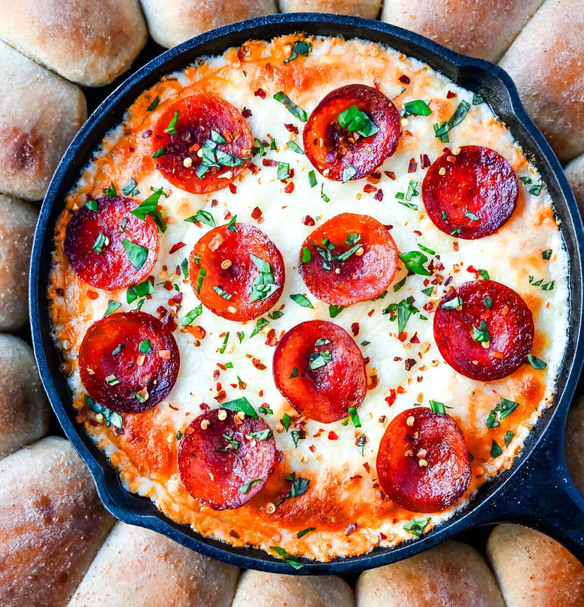 Hot Pepperoni Pizza Dip is a delicious and cheesy appetizer that brings all the classic pizza flavors. Loaded with melted cheeses, tangy marinara sauce, creamy cream cheese, and plenty of crispy pepperoni, this party dip is perfect for game days, potlucks, or get-togethers. It’s an easy appetizer recipe that can be whipped up in no time with minimal effort. The hot pepperoni pizza dip pairs well with homemade pizza dough rolls. 