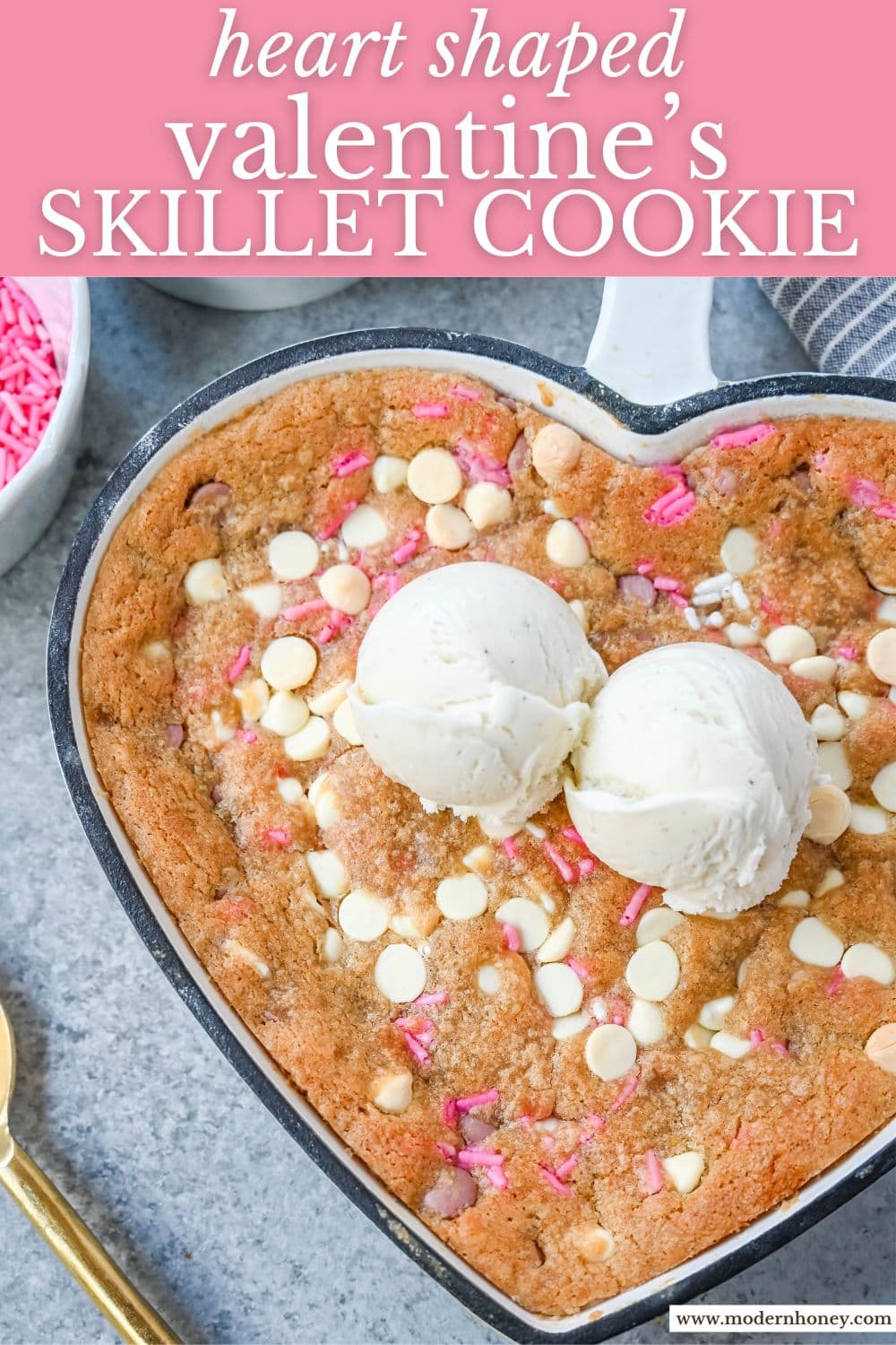 Valentine's Day Heart Skillet Cookie. Soft, chewy skillet cookie recipe filled with white chocolate chips, pink sprinkles, and any of your favorite festive additions such as Valentine's Day M&M's and ruby chocolate. Top it with vanilla ice cream and have the perfect Valentine's Day dessert.