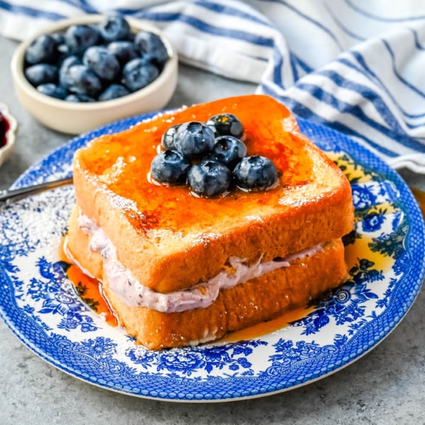 Blueberry Cheesecake Stuffed French Toast. This Blueberry Cream Cheese Stuffed French Toast Recipe is made with soft, thick bread stuffed with a homemade blueberry cream cheese and dipped in a vanilla custard batter and cooked until golden.