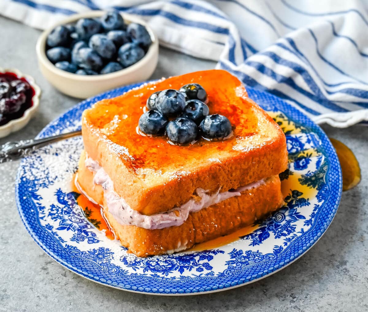 Blueberry Cheesecake Stuffed French Toast. This Blueberry Cream Cheese Stuffed French Toast Recipe is made with soft, thick bread stuffed with a homemade blueberry cream cheese and dipped in a vanilla custard batter and cooked until golden. 